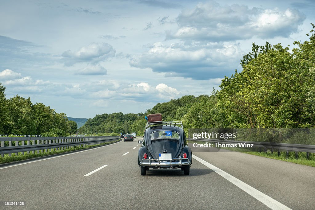 Historic VW Bug  with Luggage on the roof