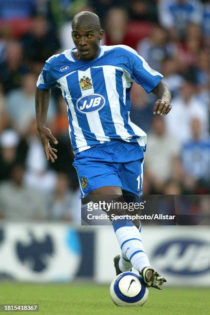 August 14: Damien Francis of Wigan Athletic on the ball during the Premier League match between Wigan Athletic and Chelsea at the JJB Stadium on...