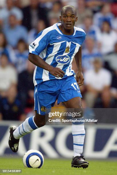 August 14: Damien Francis of Wigan Athletic on the ball during the Premier League match between Wigan Athletic and Chelsea at the JJB Stadium on...