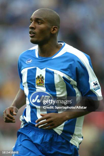 August 14: Damien Francis of Wigan Athletic running during the Premier League match between Wigan Athletic and Chelsea at the JJB Stadium on August...