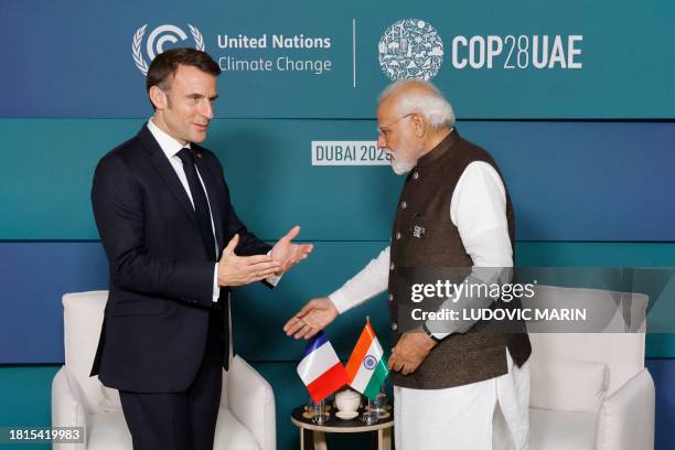 India Prime Minister Narendra Modi meets with French President Emmanuel Macron on the sidelines of the Transforming Climate Finance session at the...