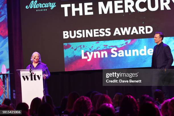 Lynn Saunders, winner of The Mercury Business Award, and David Morrissey attend the Women in Film & Television Awards 2023 at London Hilton Park Lane...
