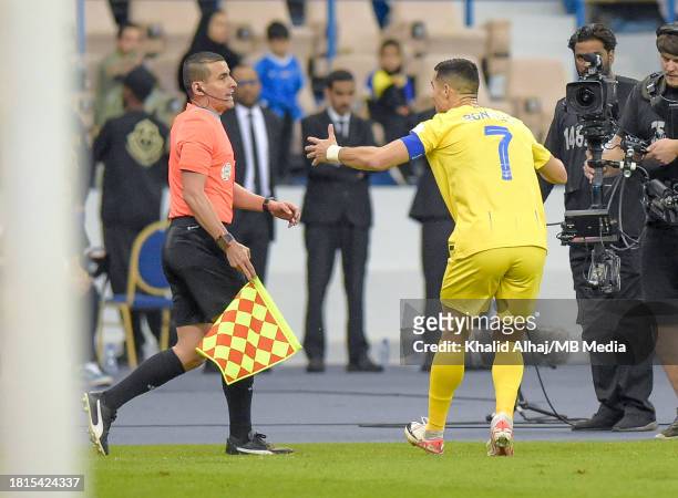 Cristiano Ronaldo of Al-Nassr complains to an assistant referee after his goal was disallowed during the Saudi Pro League match between Al-Hilal and...