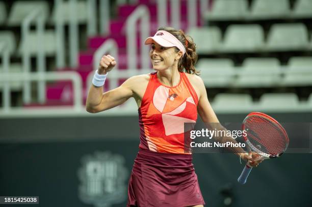 Alize Cornet of France is celebrating her victory in the round of 16 at the Creand Andorra Open Women's Tennis Association 2023 tennis tournament at...