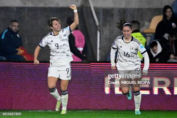Italy's forward Valentina Giacinti celebrates scoring her team's first goal, next to Italy's midfielder Giulia Dragoni, during the UEFA Women's...