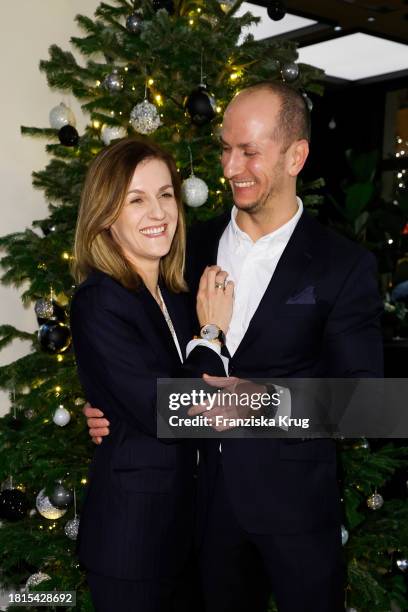 Magdalena Jarczak and Lukasz Jarczak during the IWC Christmas Cocktail at IWC Schaffhausen Boutique on December 1, 2023 in Berlin, Germany.