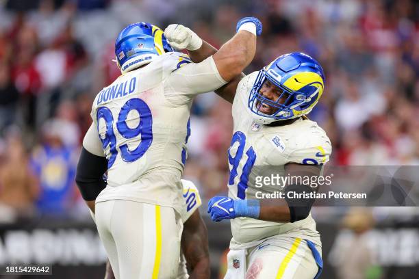 Aaron Donald of the Los Angeles Rams and Kobie Turner of the Los Angeles Rams celebrate a sack during the fourth quarter against the Arizona...