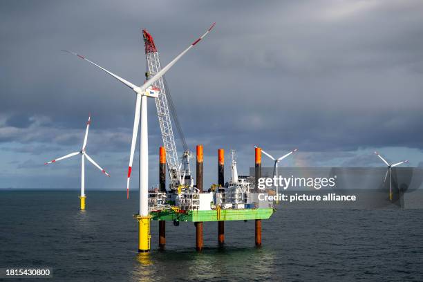November 2023, North Sea, --: The offshore wind turbine installation ship "Thor" in the Riffgat wind farm, around 15 kilometers north of the island...
