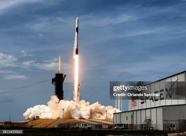 The SpaceX Falcon 9 rocket carrying astronauts Doug Hurley and Bob Behnken in the Crew Dragon capsule lifts off from Kennedy Space Center, Fla., on...