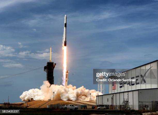 The SpaceX Falcon 9 rocket carrying astronauts Doug Hurley and Bob Behnken in the Crew Dragon capsule lifts off from Kennedy Space Center, Fla., on...