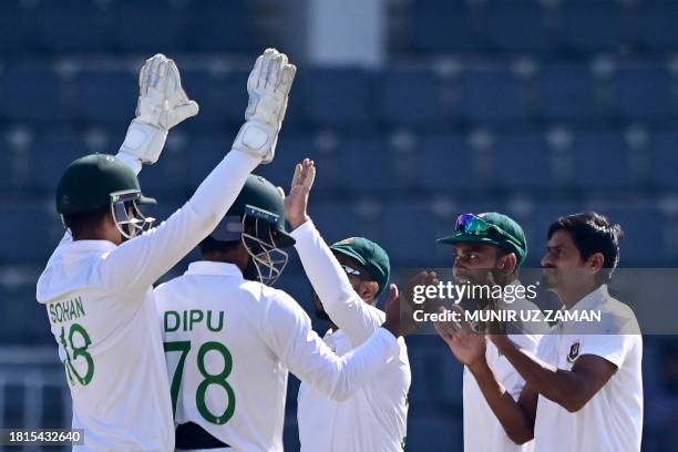 Bangladesh's celebrate the dismissal New Zealand's Tim Southee during the fifth day of the first Test cricket match between Bangladesh and New...