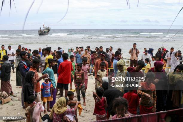 Newly arrived Rohingya refugees are seen on the coast of Jurong Mulia, in Sabang, Aceh province, on December 2, 2023.