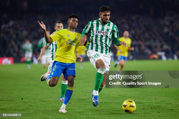 Marvin Park of UD Las Palmas competes for the ball with Chadi Riad of Real Betis during the LaLiga EA Sports match between Real Betis and UD Las...