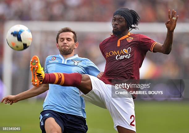 Roma forward Gervinho vies with Lazio's defenderof Bosnia and Herzegovina Senad Lulic during the Italian Serie A football derby between AS Roma and...