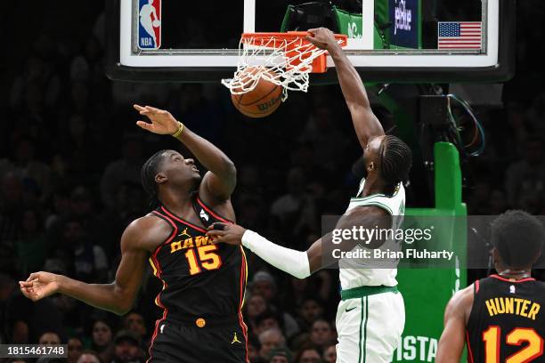 Jaylen Brown of the Boston Celtics dunks against Clint Capela of the Atlanta Hawks during the second quarter at the TD Garden on November 26, 2023 in...