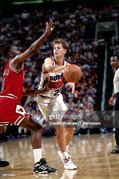 Danny Ainge of the Phoenix Suns makes a pass against the Chicago Bulls during Game One of the 1993 NBA Championship Finals at America West Arena on...