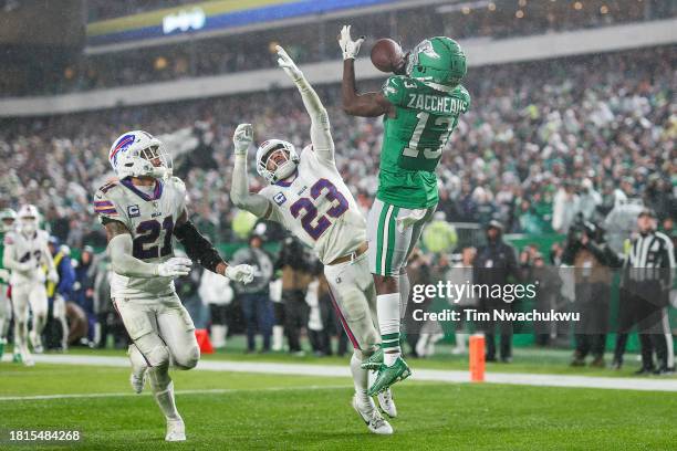 Micah Hyde of the Buffalo Bills and Jordan Poyer of the Buffalo Bills defend Olamide Zaccheaus of the Philadelphia Eagles as Zaccheaus' catches a...