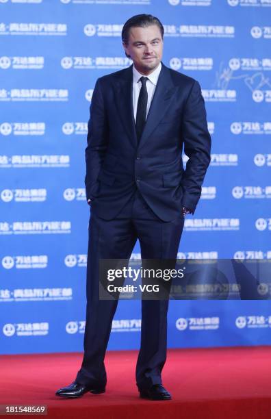 Actor Leonardo DiCaprio arrives at the red carpet during the opening night of the Qingdao Oriental Movie Metropolis at Qingdao Beer City on September...