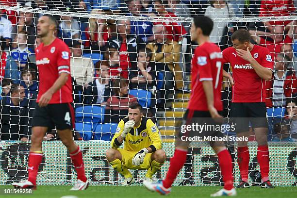 David Marshall the goalkeeper of Cardiff City is left distraught after conceding a last minute goal scored by Paulinho of Tottenham Hotspur during...