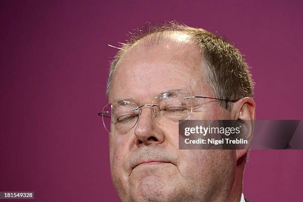 Peer Steinbrueck, chancellor candidate of the German Social Democrats reacts to initial exit poll results at SPD party headquarters on September 22,...