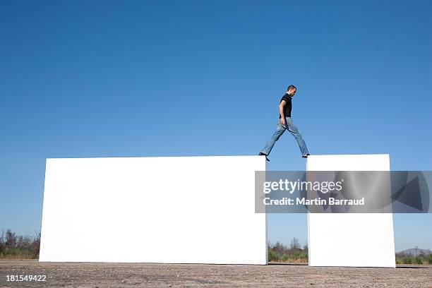 man walking on blocks outdoors - the next step stock pictures, royalty-free photos & images