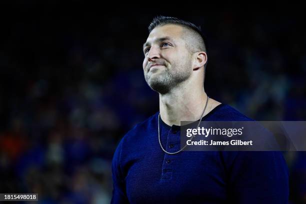 Former Florida Gators Quarterback and Heisman Trophy winner Tim Tebow reacts as he is honored after being inducted into the College Football Hall of...