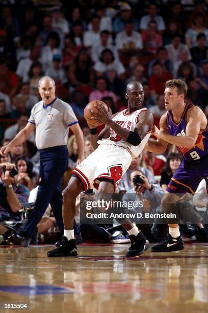 Michael Jordan of the Chicago Bulls looks to make a play against the Phoenix Suns during Game Five of the 1993 NBA Championship Finals at Chicago...