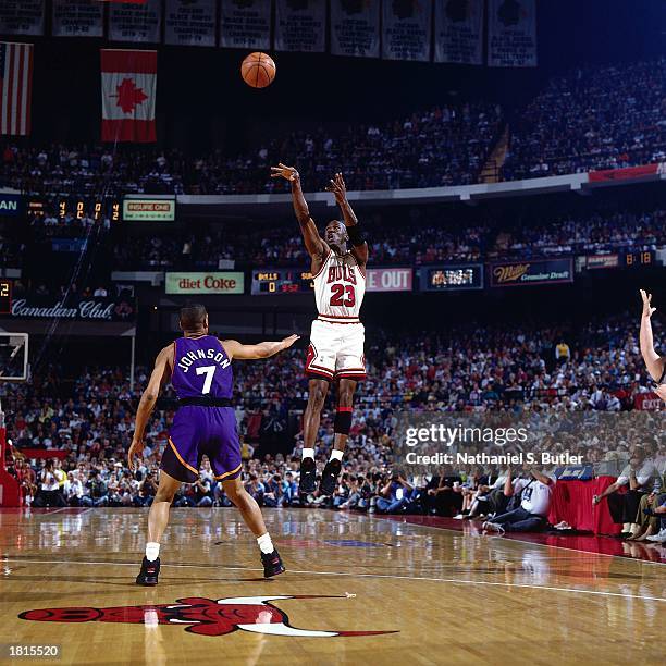Michael Jordan of the Chicago Bulls takes a jumper against the Phoenix Suns during Game Five of the 1993 NBA Championship Finals at Chicago Stadium...