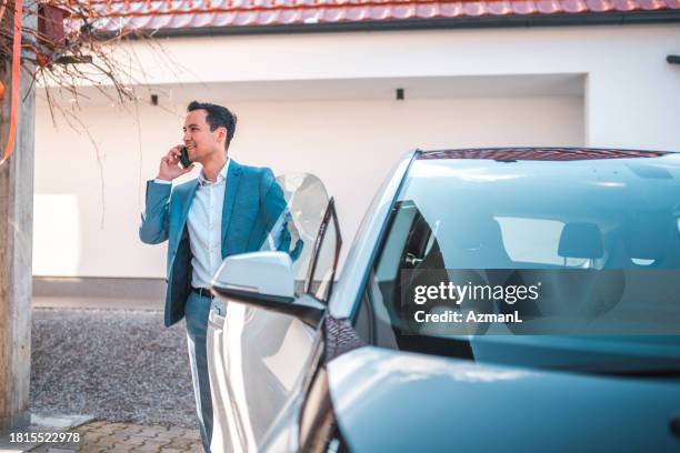 busy japanese manager on his way to work - car door stock pictures, royalty-free photos & images