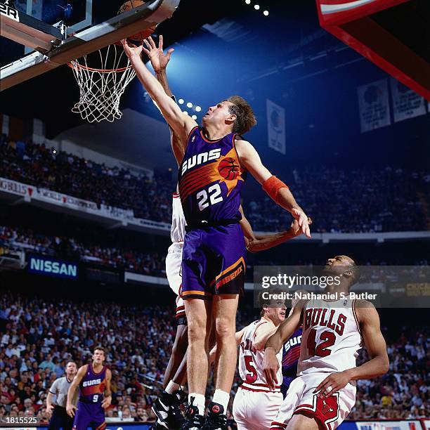Danny Ainge of the Phoenix Suns goes for layup against the Chicago Bulls during Game Five of the 1993 NBA Championship Finals at Chicago Stadium on...