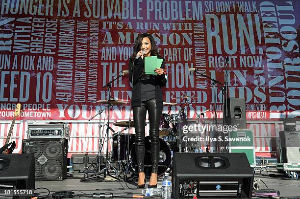 Actress Naya Rivera speaks during the Women's Health Magazine RUN10 FEED10 NYC 10K Race Event at Pier 84 on September 22, 2013 in New York City.