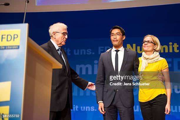 Philipp Roesler , Chairman of the German Free Democrats , his wife Wiebke Roesler and German Free Democrats lead candidate Rainer Bruederle leave the...
