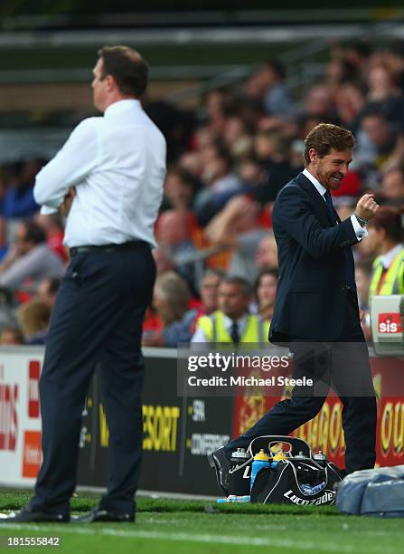 Andre Villas-Boas the manager of Tottenham Hotspur clenches his fist after his side score a last minute winner as Malkay Mackay the manager of...