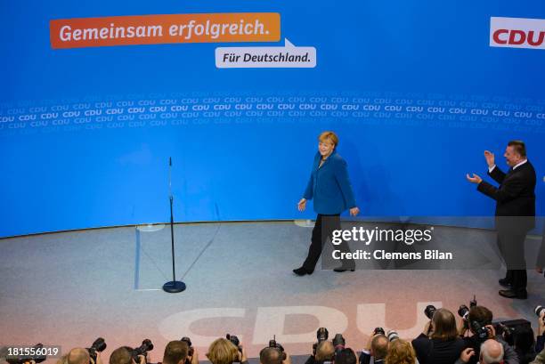 Angela Merkel, German Chancellor and Chairwoman of the German Christian Democrats , and CDU Secretary General Hermann Groehe arrive after the initial...