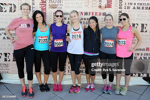 Runners attend the Women's Health Magazine RUN10 FEED10 NYC 10K Race Event at Pier 84 on September 22, 2013 in New York City.