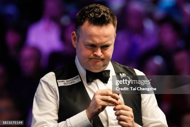 Shaun Murphy of England chalks the cue in the first round match against Hossein Vafaei of Iran on day 2 of the 2023 MrQ UK Championship at York...