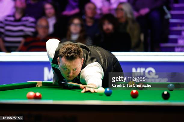 Shaun Murphy of England plays a shot in the first round match against Hossein Vafaei of Iran on day 2 of the 2023 MrQ UK Championship at York...