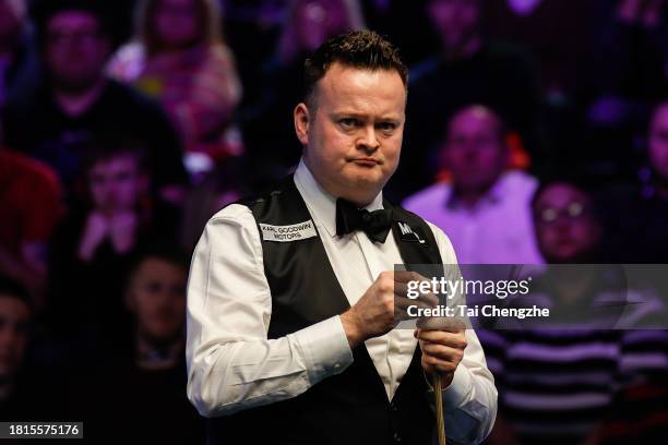 Shaun Murphy of England chalks the cue in the first round match against Hossein Vafaei of Iran on day 2 of the 2023 MrQ UK Championship at York...