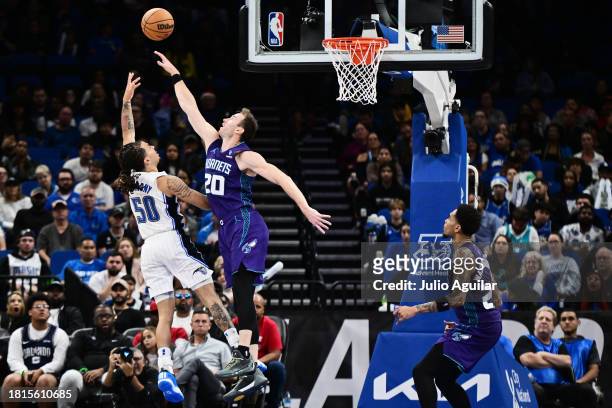 Cole Anthony of the Orlando Magic shoots against Gordon Hayward of the Charlotte Hornets in the second half of a game at Amway Center on November 26,...