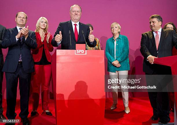 Social Democrats chancellor candidate Peer Steinbrueck and Sigmar Gabriel , SPD Federal Chairman, react with Olaf Scholz, Hamburg's First Mayor,...