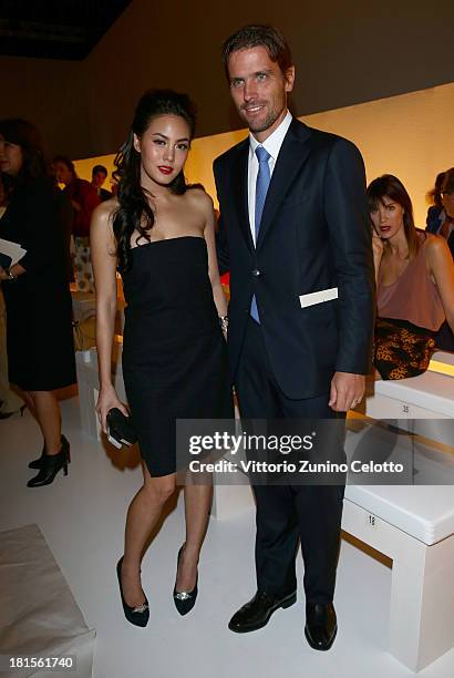 Janie Tienphosuwan and James Ferragamo attends the Salvatore Ferragamo show as part of Milan Fashion Week Womenswear Spring/Summer 2014 at on...