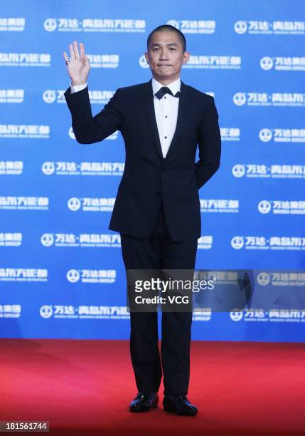Actor Tony Leung Chiu-Wai arrives at the red carpet during the opening night of the Qingdao Oriental Movie Metropolis at Qingdao Beer City on...