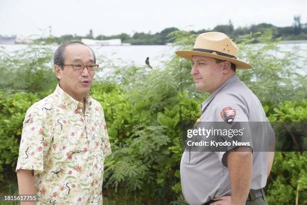 Hiroshima Mayor Kazumi Matsui has a conversation with a park ranger during a visit to Pearl Harbor National Memorial in Honolulu on Dec. 1, 2023....