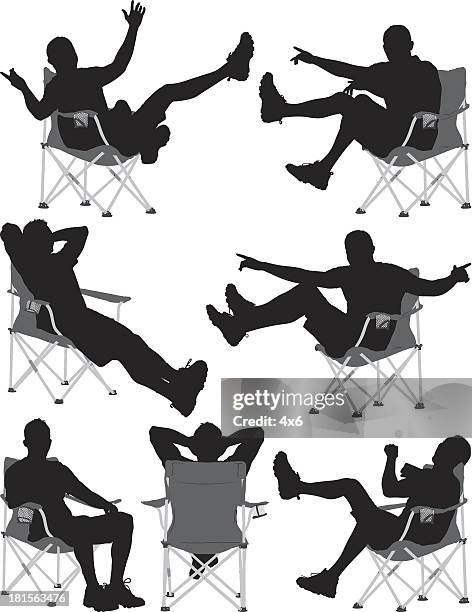 silhouetten von einem mann sitzen im stuhl - folding chair stock-grafiken, -clipart, -cartoons und -symbole