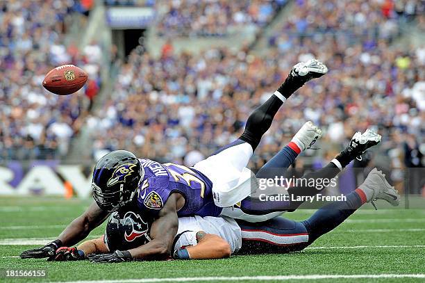 Strong safety James Ihedigbo of the Baltimore Ravens breaks up a pass intended for tight end Owen Daniels of the Houston Texans at M&T Bank Stadium...