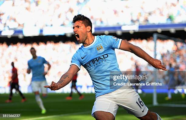 Sergio Aguero of Manchester City celebrates as he scores their first goal during the Barclays Premier League match between Manchester City and...