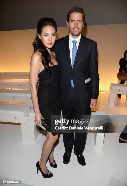 Janie Tienphosuwan and James Ferragamo attend the Salvatore Ferragamo show as part of Milan Fashion Week Womenswear Spring/Summer 2014 at on...