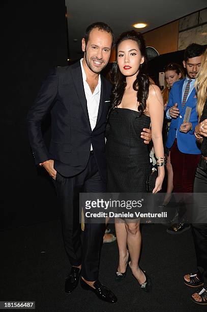 Massimiliano Giornetti and Janie Tienphosuwan attend the Salvatore Ferragamo show as part of Milan Fashion Week Womenswear Spring/Summer 2014 at on...