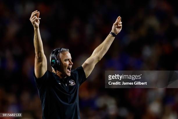 Head coach Mike Norvell of the Florida State Seminoles reacts during the first half of a game against the Florida Gators at Ben Hill Griffin Stadium...