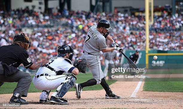 Jeff Keppinger of the Chicago White Sox doubles to deep right field scoring Conor Gillaspie and Jordan Danks in the seventh inning of the game...